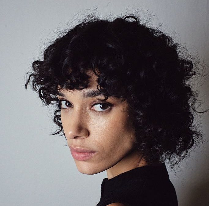 Now You Know—20 Ways to Style Curly Hair With Bangs